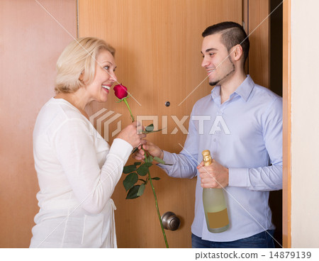 man and woman standing at doorway man and woman standing at doorway 14879139