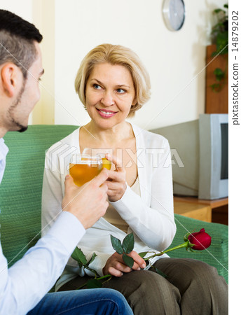 Happy mature woman with boyfriend having date Happy mature woman with boyfriend having date 14879202