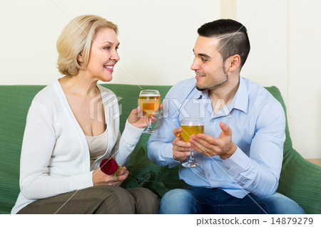 Mature woman with young guy indoors 14879279