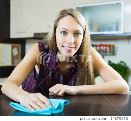 Housewife cleaning furniture in kitchen 14879280