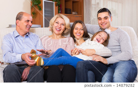 United family in living room 14879282