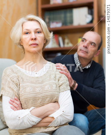 Couple after quarrel indoors 14879371