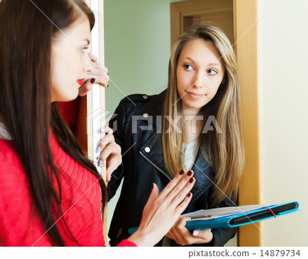young employee polling among people at home 14879734
