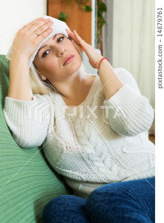 Tired girl sitting on sofa 14879761