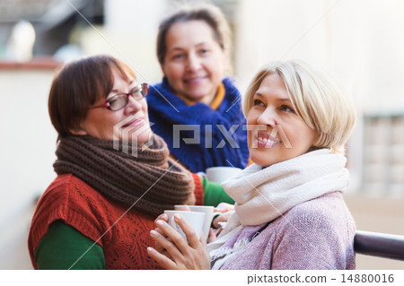 Female having tea on terrace 14880016
