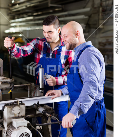 Two workmen in PVC shop 14880161