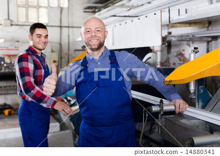 workers near milling machine 14880341