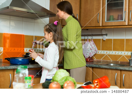 girl and mom with casserole girl and mom with casserole 14880487