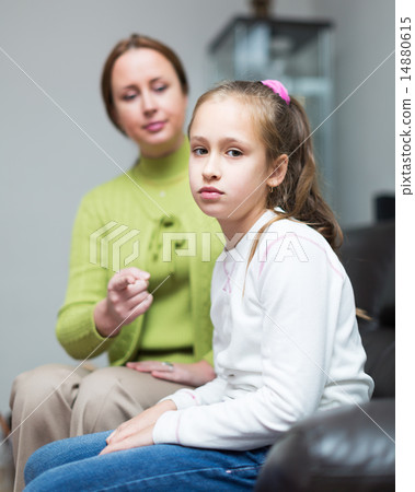 Woman berating daughter in home 14880615