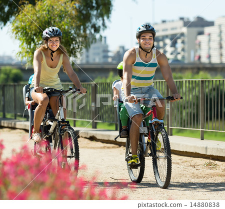 Family of four traveling by bicycles Family of four traveling by bicycles 14880838
