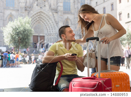 Couple with GPS navigator and baggage Couple with GPS navigator and baggage 14880953