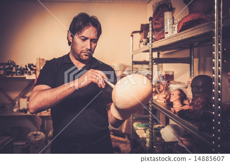 Man working in a prosthetic special fx workshop 14885607