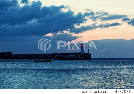 Beacon and the boat taking to the open sea at sunr Beacon and the boat taking to the open sea at sunr 14887028