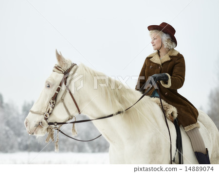 White horse and riding woman White horse and riding woman 14889074