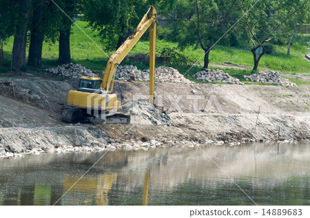 Yellow Excavator at Riverbank 14889683
