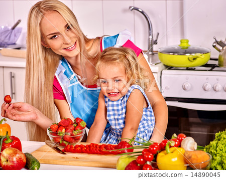 Mother feed child at kitchen. Mother feed child at kitchen. 14890045