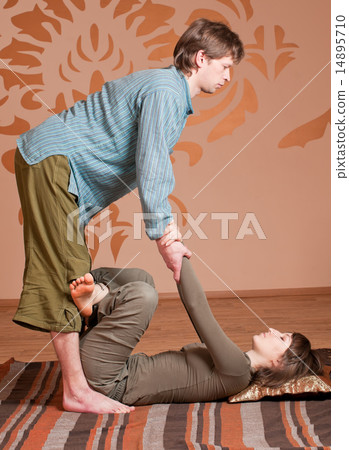 Couple doing yoga. Massage Couple doing yoga. Massage 14895710