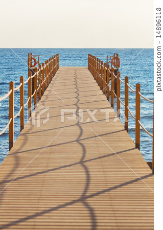 Blue sea and wooden pier 14896118