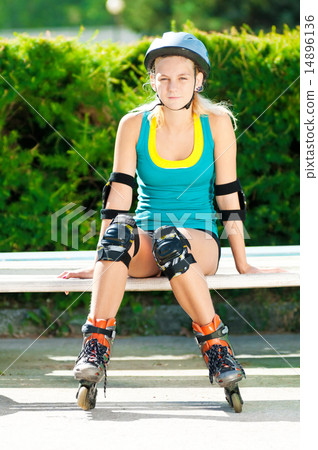 Young brunette woman on roller skates 14896136