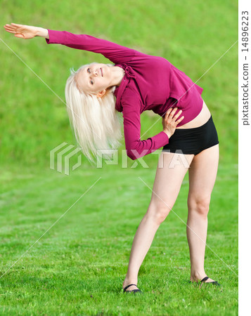 Beautiful woman doing yoga stretching exercise Beautiful woman doing yoga stretching exercise 14896223