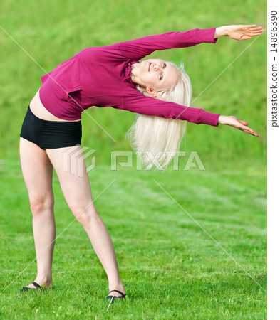 Beautiful woman doing yoga stretching exercise Beautiful woman doing yoga stretching exercise 14896390