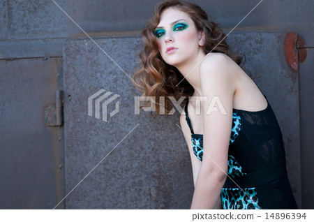 Fashion woman with green make-up at rural location Fashion woman with green make-up at rural location 14896394