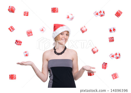 Portrait of girl in grey dress and santa hat over gift fall Portrait of girl in grey dress and santa hat over gift fall 14896396