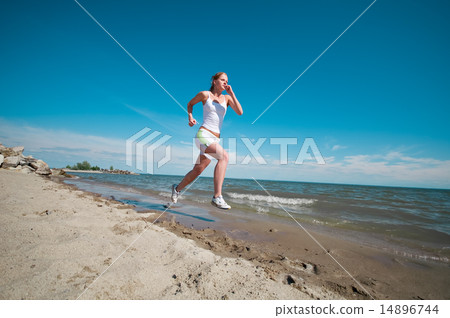Sport woman running in sea coast Sport woman running in sea coast 14896744