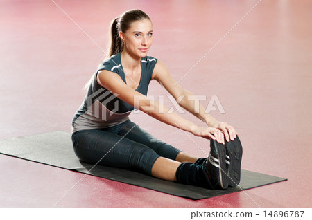 Woman doing stretching fitness exercise at sport gym. Yoga Woman doing stretching fitness exercise at sport gym. Yoga 14896787
