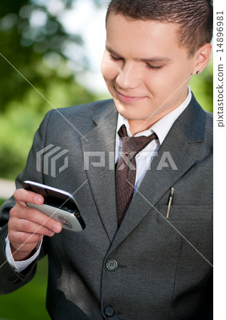 business man talk by mobile phone. Student business man talk by mobile phone. Student 14896981