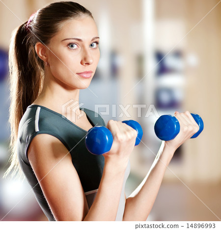 Beautiful sport woman doing exercise with dumbbell 14896993