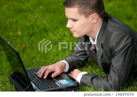 business man work on notebook at park. Student business man work on notebook at park. Student 14897070