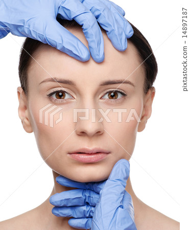 Beautician touch and exam health woman face. 14897187