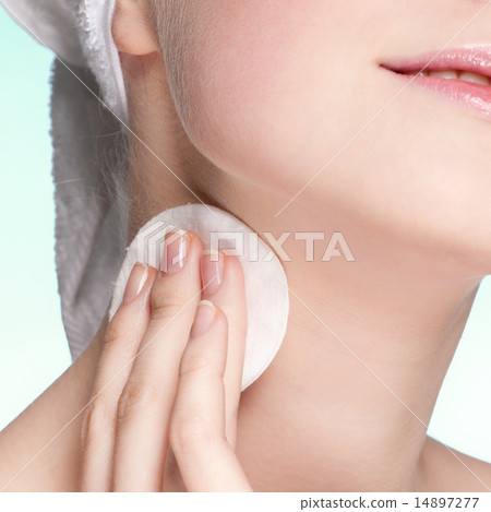 Close-up face of young woman applying sponge Close-up face of young woman applying sponge 14897277