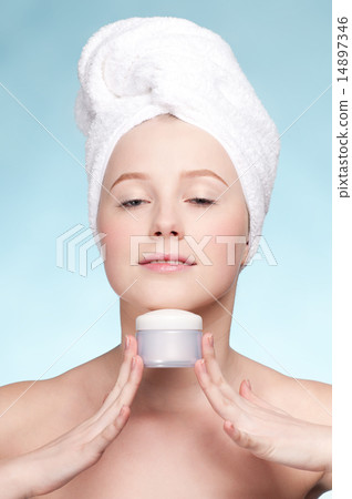 Beautiful woman tender jar of moisturizer cream 14897346