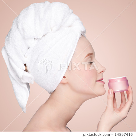 Beautiful woman tender jar of moisturizer cream 14897416