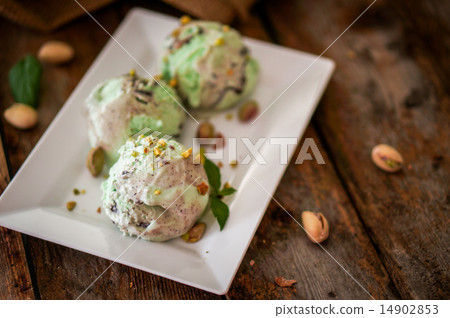 Pistachio ice-cream on wooden background Pistachio ice-cream on wooden background 14902853