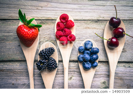 Berries on wooden rustic background Berries on wooden rustic background 14903509