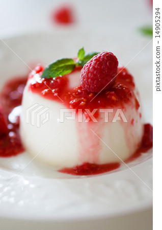 Delicious italian dessert panna cotta with raspberry sauce and m 14905294