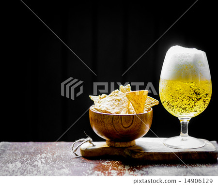 Beer and chips on wooden background 14906129