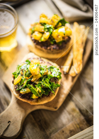Homemade burgers with fries on wooden background Homemade burgers with fries on wooden background 14906407