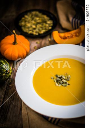 Pumpkin soup on wooden background Pumpkin soup on wooden background 14906732