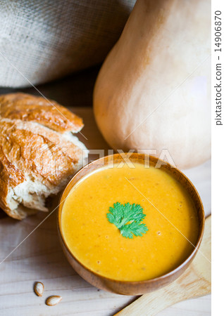 Butternut squash soup with homemade bread on wooden background 14906870