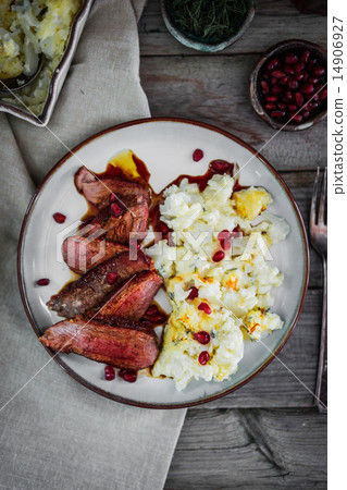 Grilled steak with cauliflower and pomegranate 14906927