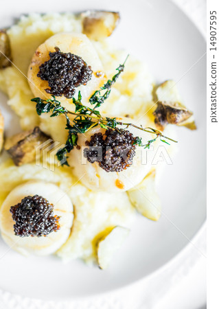 Scallops with black caviar Scallops with black caviar 14907595