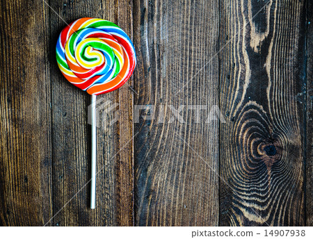Lollipop on wooden background Lollipop on wooden background 14907938