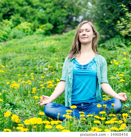 Pretty woman meditate in the park Pretty woman meditate in the park 14908458