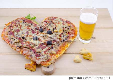 Heart shaped pizza and a glass of beer Heart shaped pizza and a glass of beer 14909981