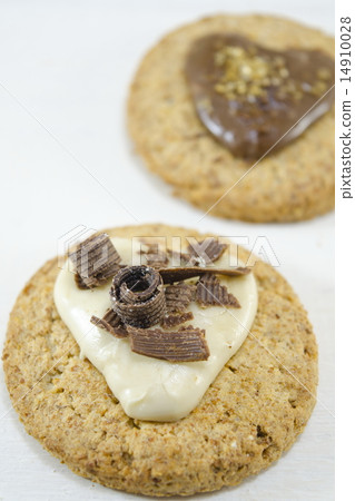 Oatmeal cookies with cream and chocolate on white 14910028