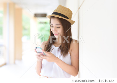 Young Chinese woman using smartphone 14910482